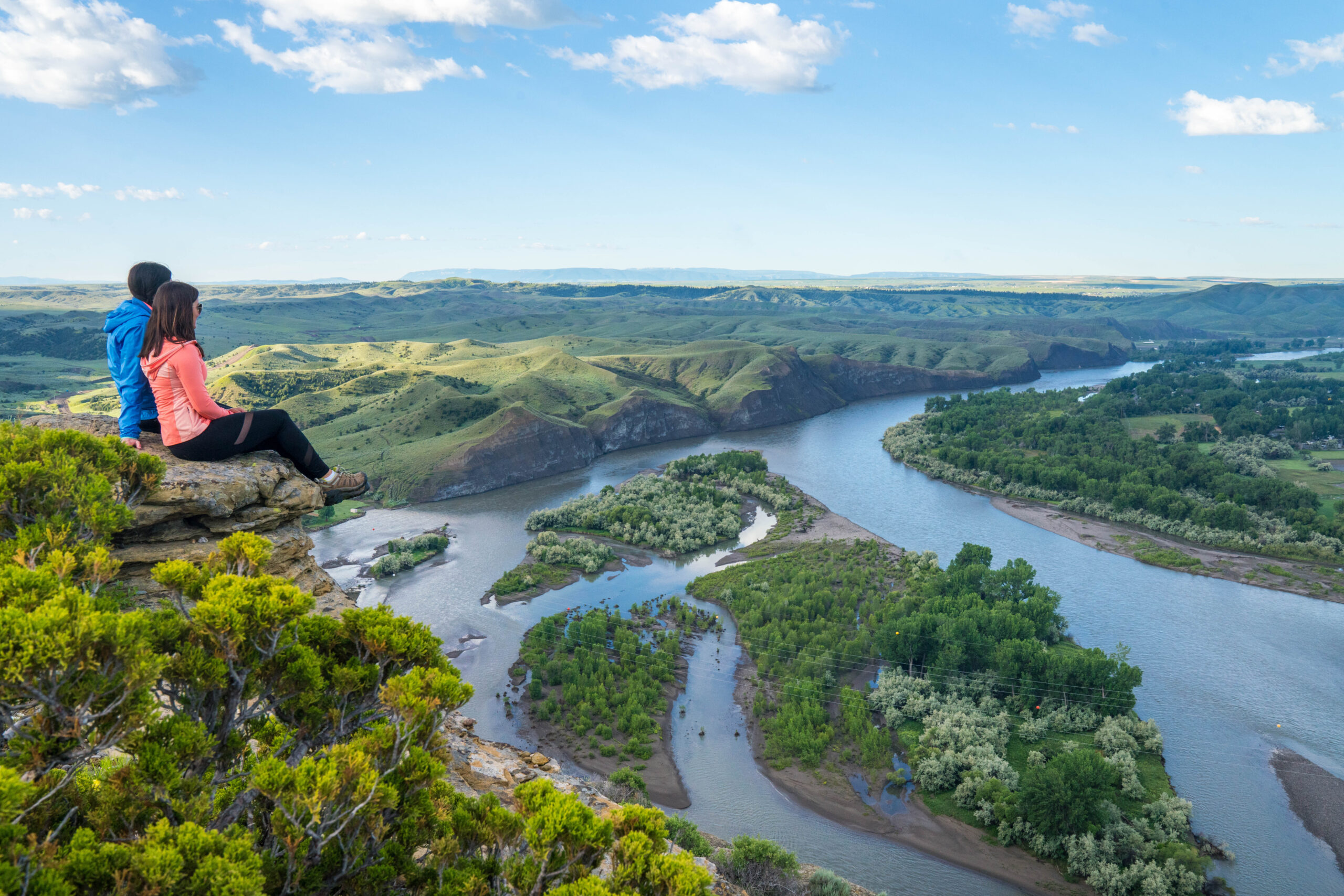 Two people sitting over Lake Elmo State Park.