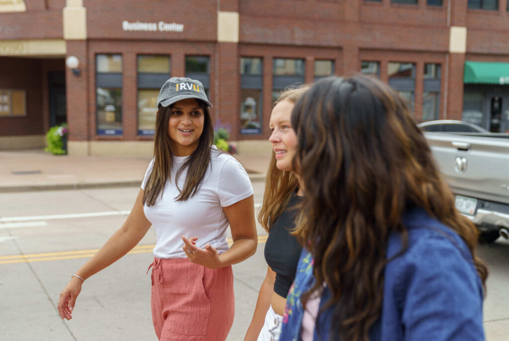 Students walking on the street in street clothes. 