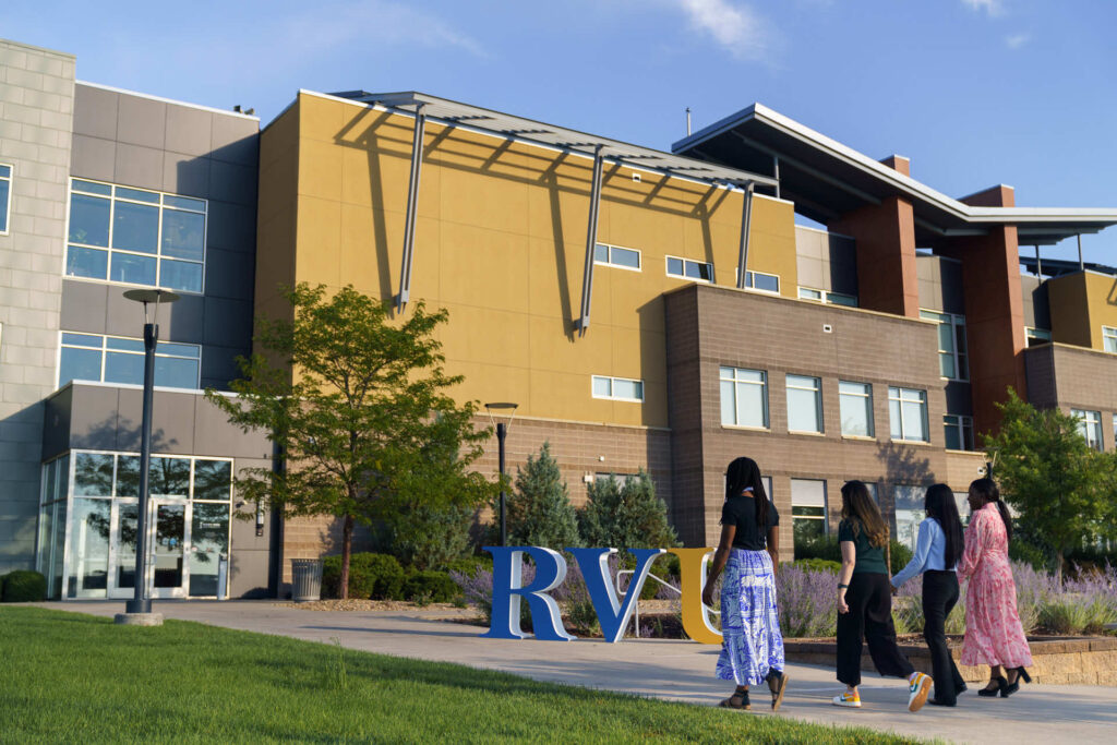 Students walking outdoors on campus