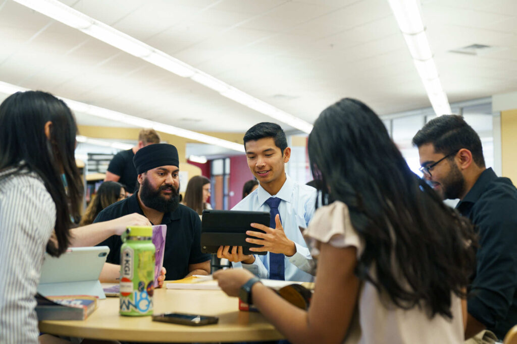 Group of diverse med students working on a project. 