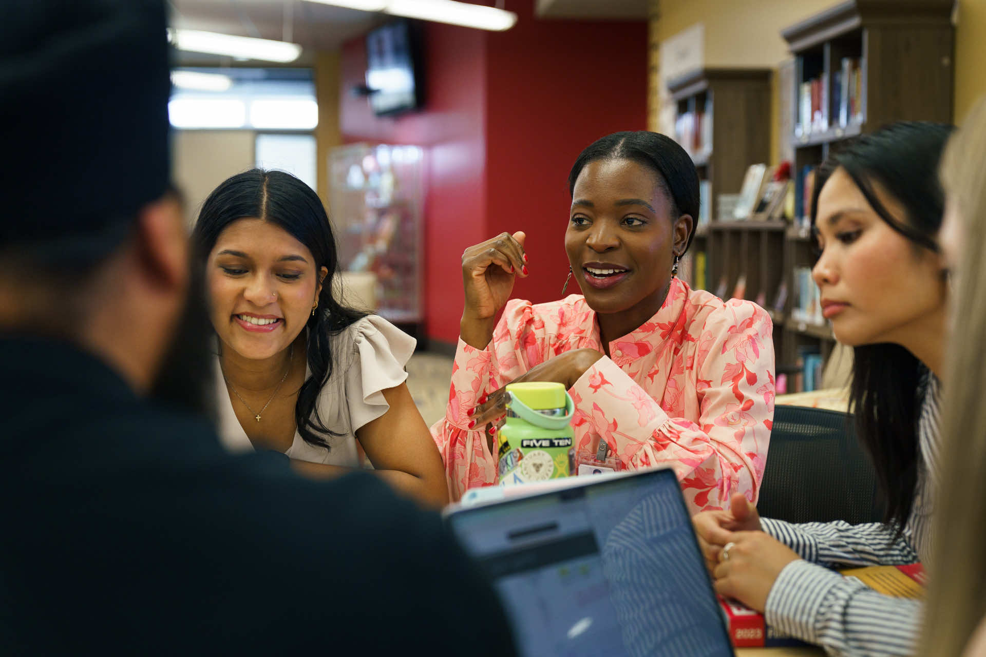 Med students working in a group smiling.