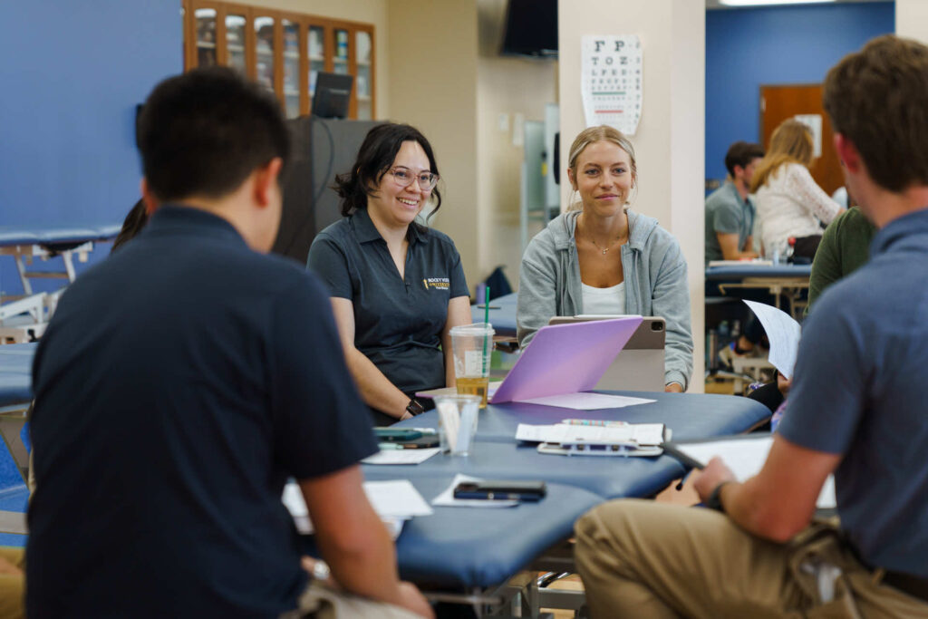 Group of students sitting around a table