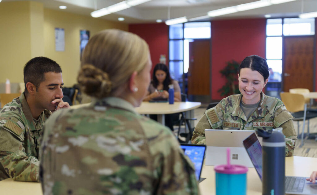 Group of military students studying together. 