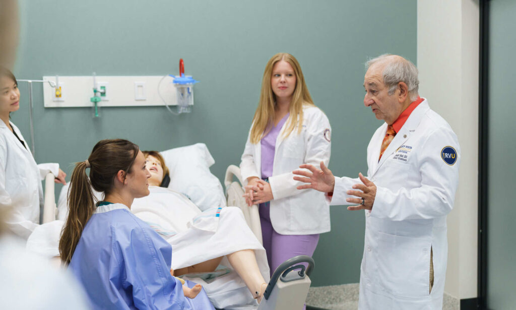 women and 2 doctors in patient room on Montana campus. 