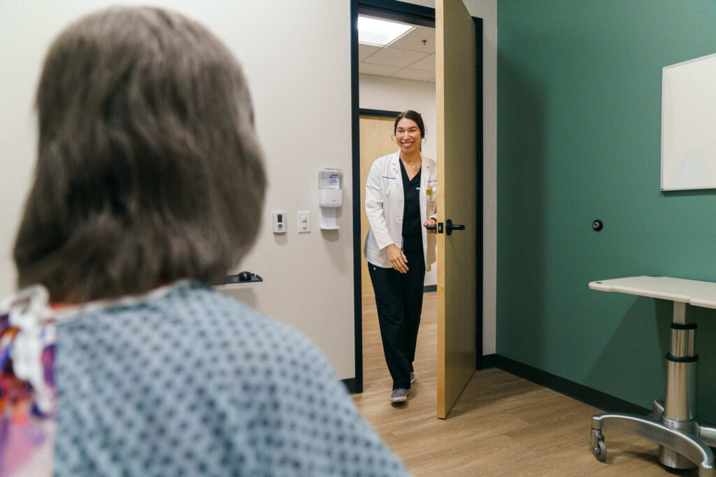 Doctor walking into patient room. 