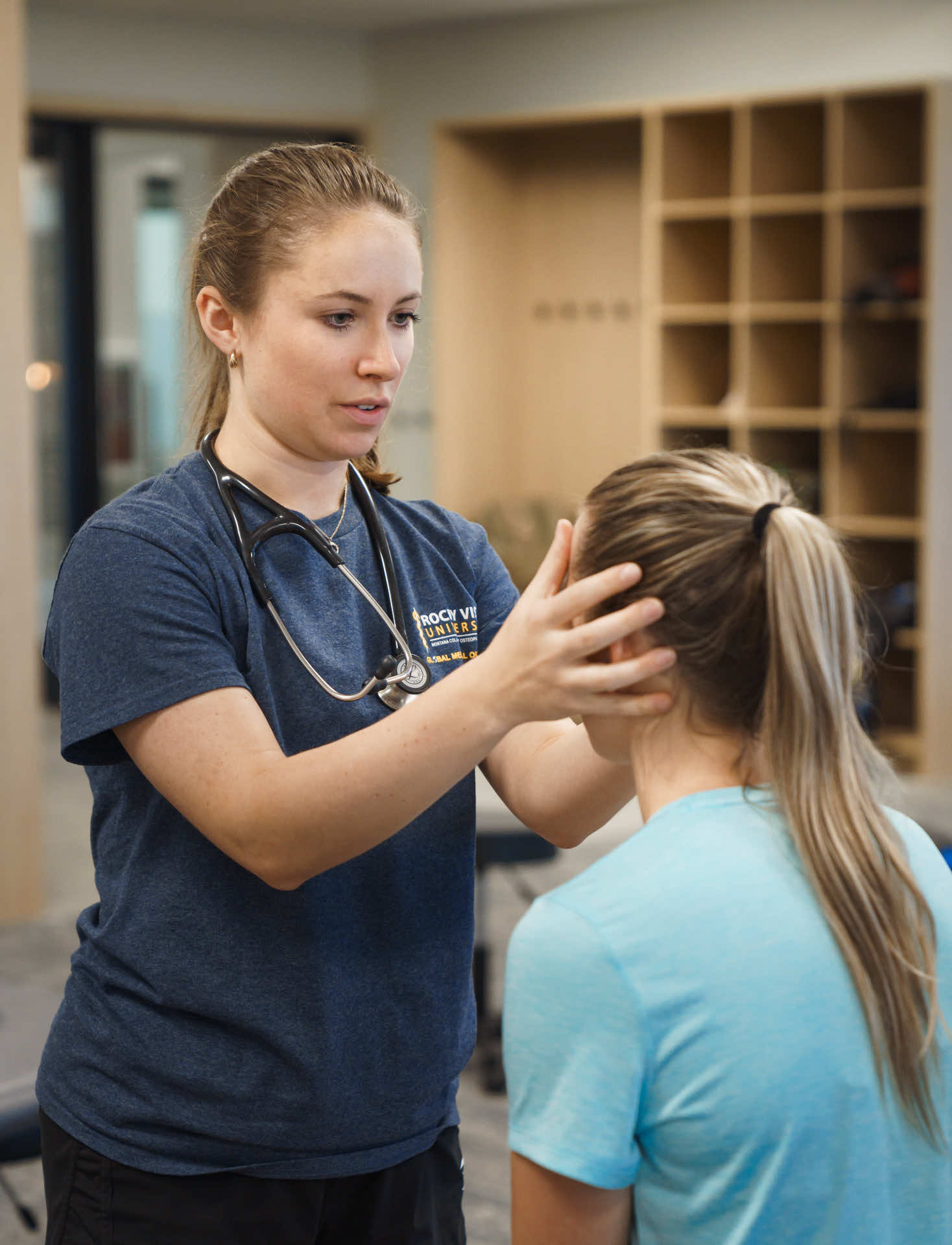 Two female med students practicing an exam