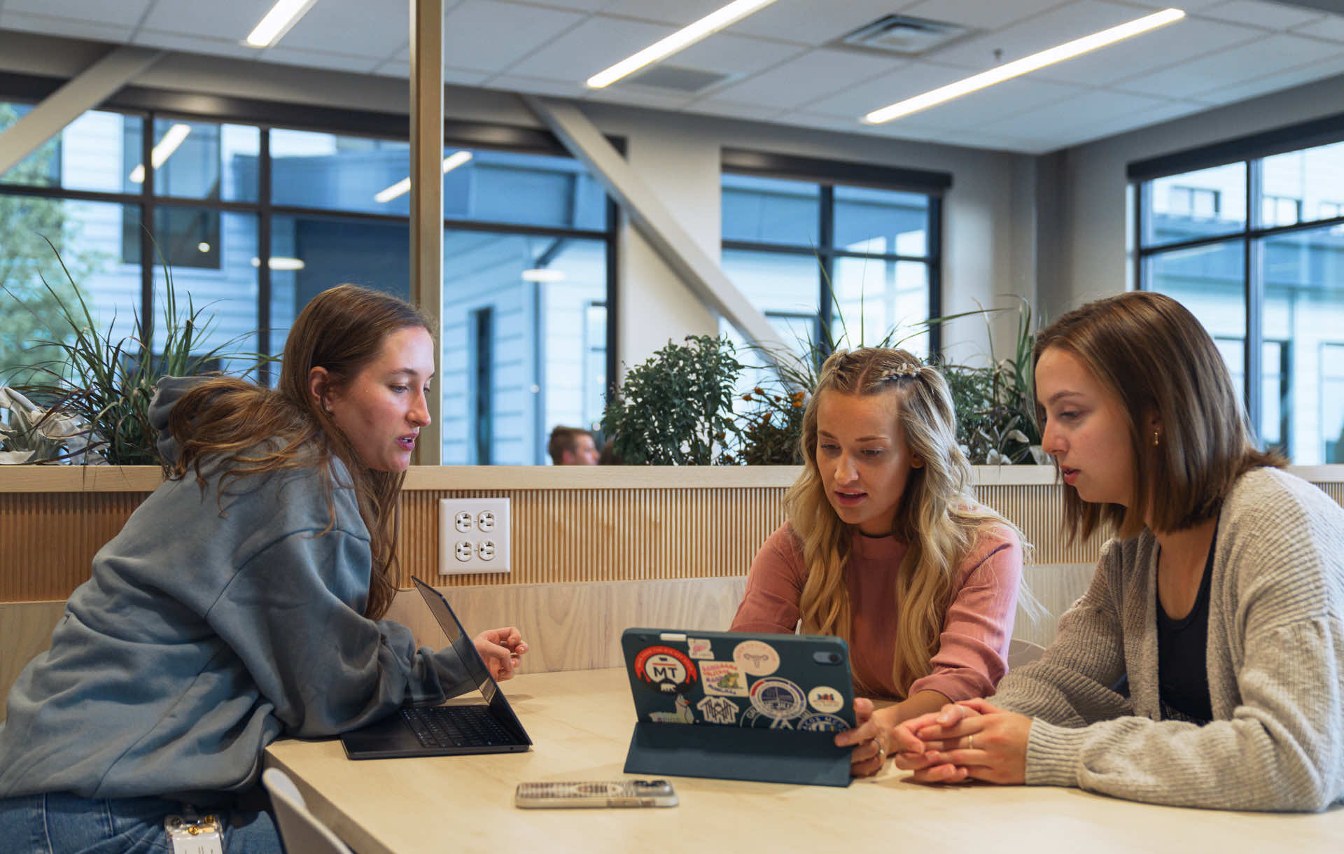 Students studying around table.