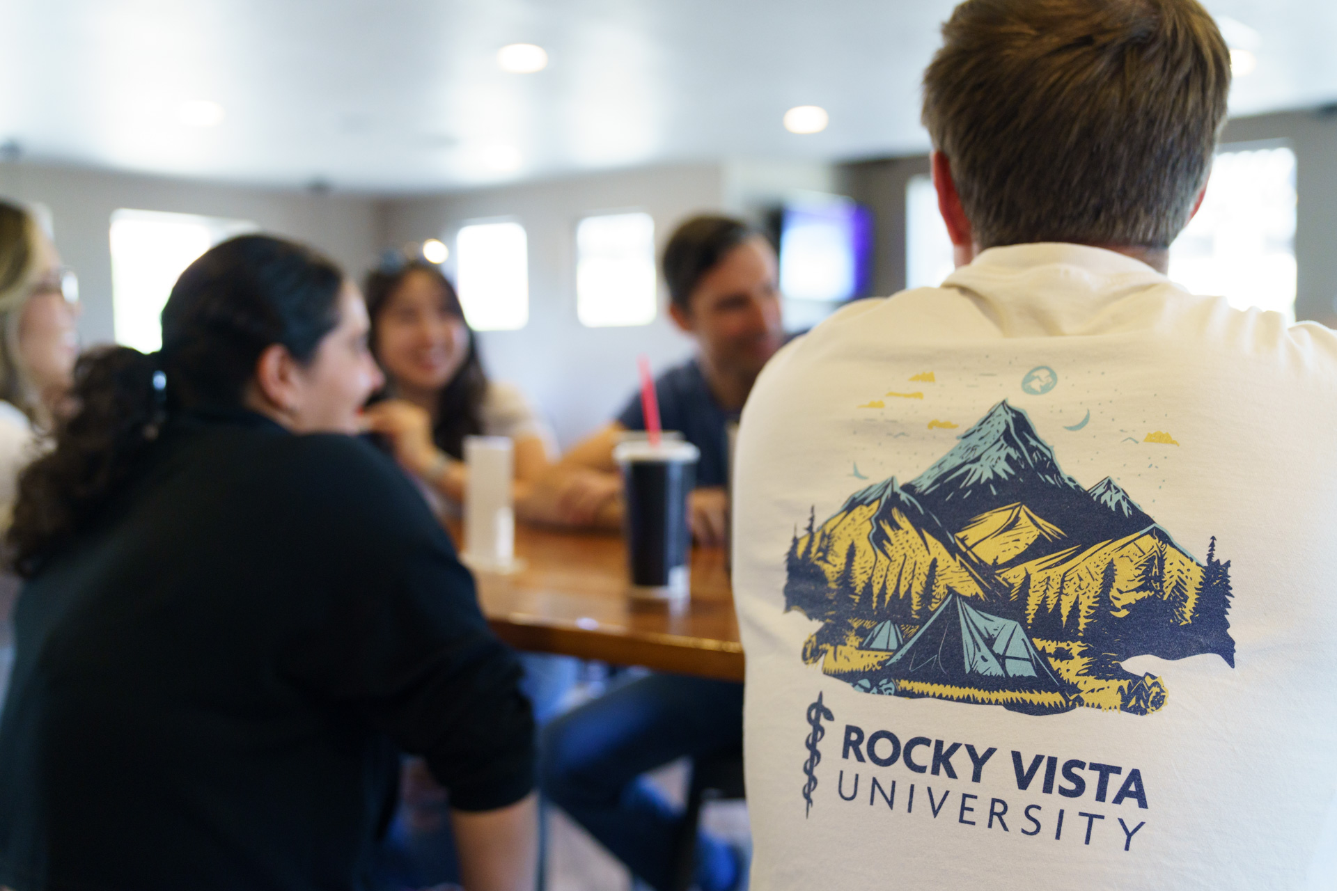 Students chatting at the table